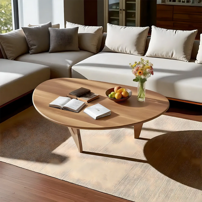Minimalist round wooden coffee table, gently curved design combined with colors create a soft, cozy feeling 